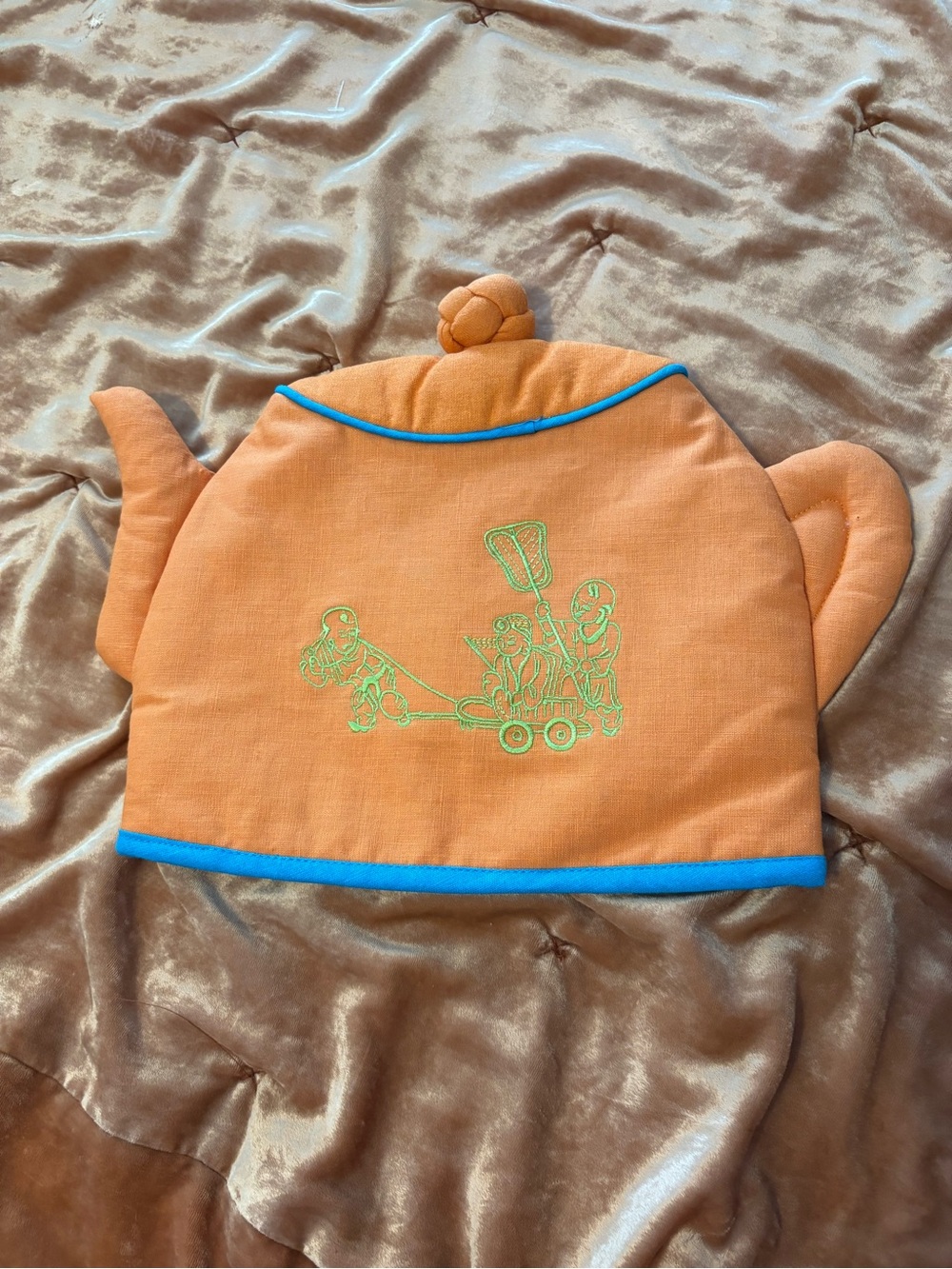 Orange Tea Cozy with Blue Trim and Green Chinese Scene Embroidery